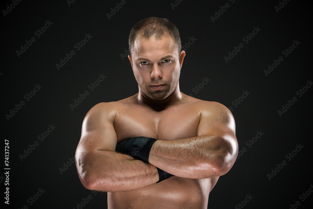 studio portrait of young caucasian boxer with folded hands