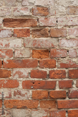 Decaying old brick and mortar wall