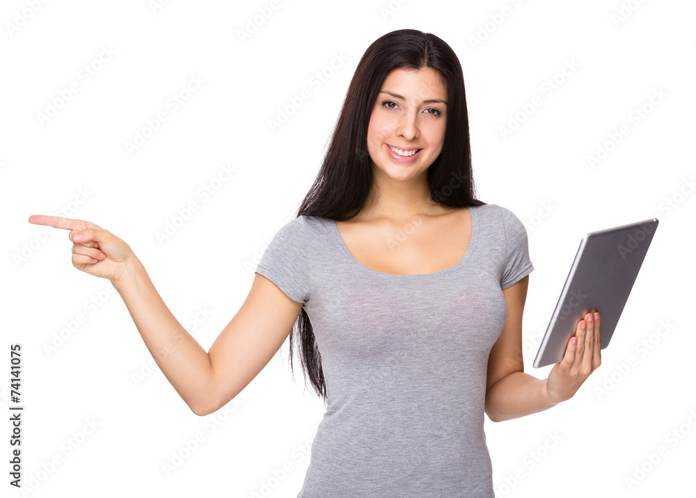 Woman use of tablet and finger point aside Woman use of tablet and finger point aside
