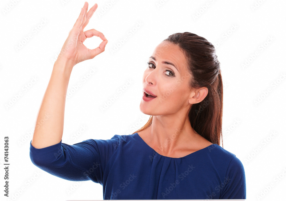 Lovely woman smiling and making an ok sign Lovely woman smiling and making an ok sign