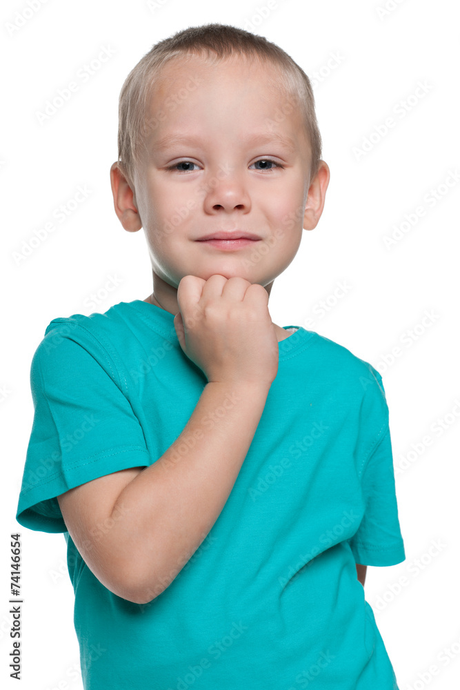 Pensive little boy in a blue shirt Pensive little boy in a blue shirt