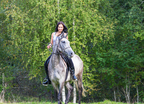 Elegant attractive oman riding a horse © AnnaMoskvina