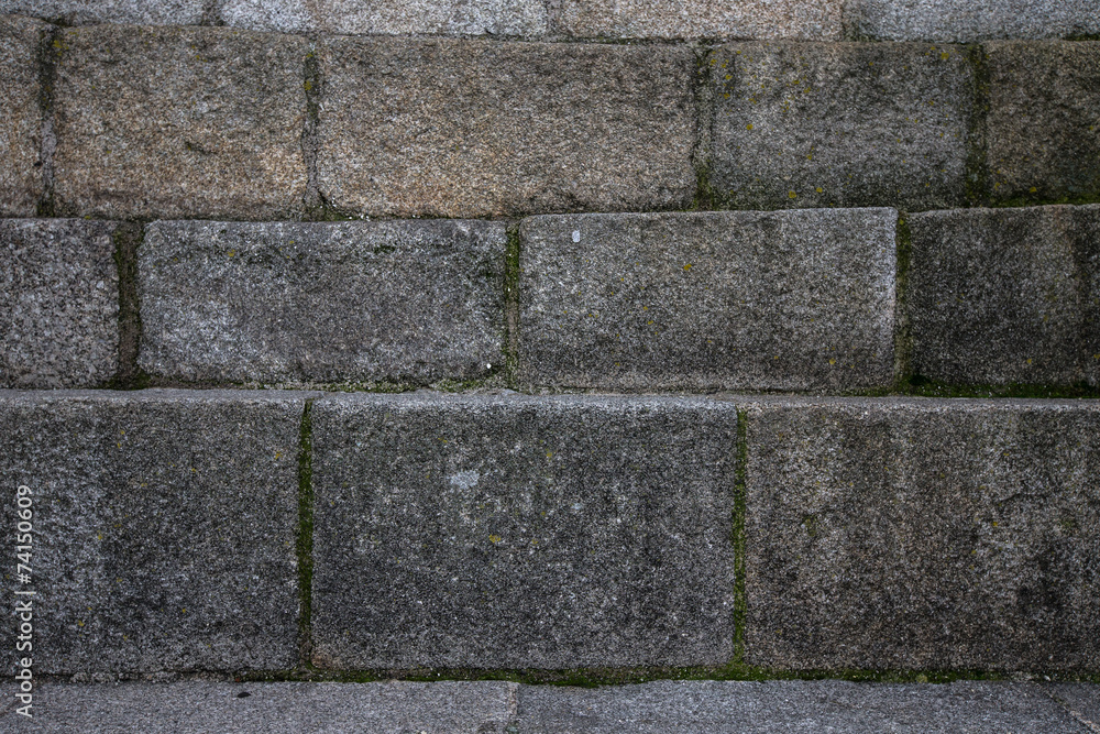 Natural stones are folded in wall. Background. Natural stones are folded in wall. Background.