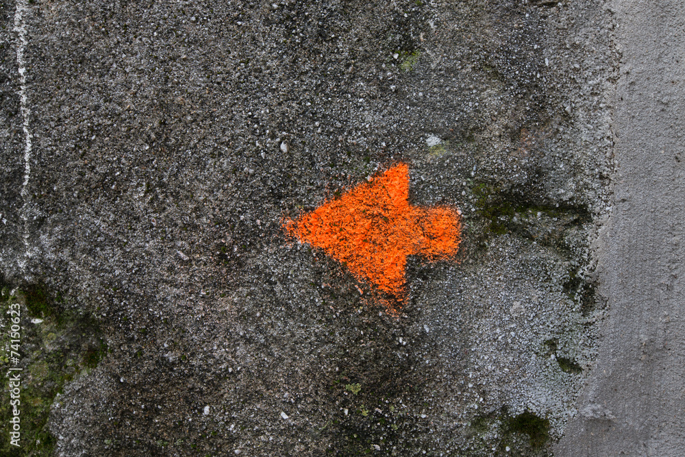 Arrow painted on the wall. background Arrow painted on the wall. background