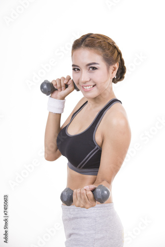 Young woman working out with dumbbells isolated on white backgro