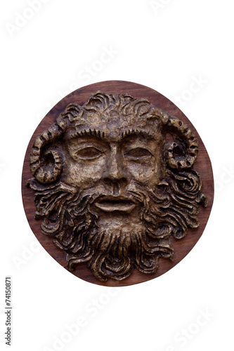 Bas-relief Faunus of the Greek deity made on wood isolated on w