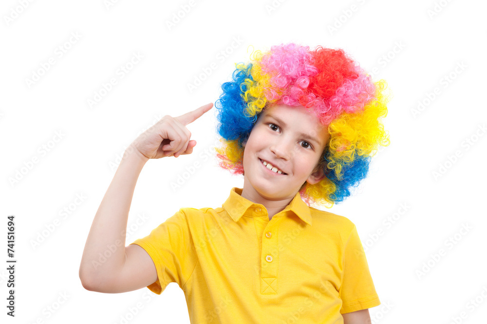 boy pointing his finger at his multi-coloured wig boy pointing his finger at his multi-coloured wig