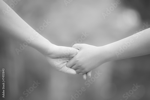 Hands of lovers, men and women in monochrome, soft focus