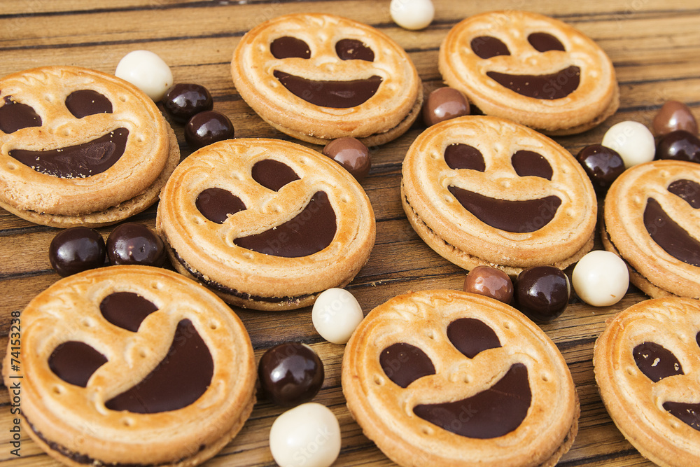 Round smiling chocolate cookies with chocolate balls Round smiling chocolate cookies with chocolate balls