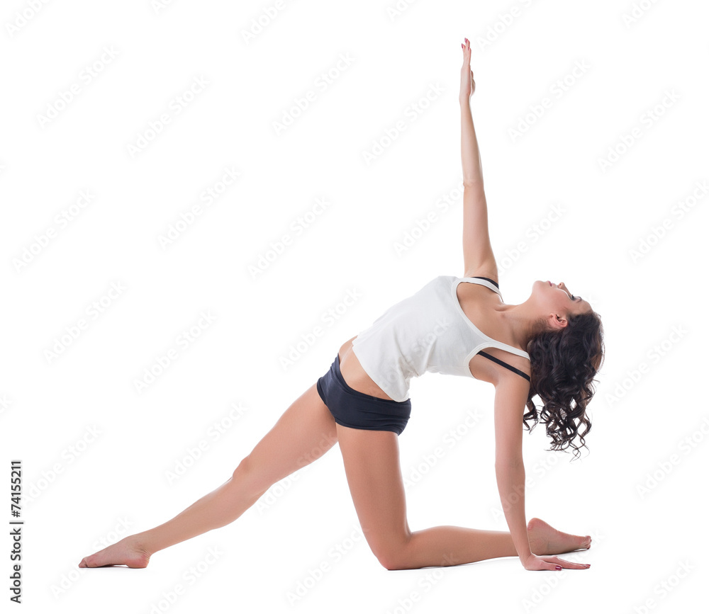 Beautiful curly-haired woman exercising pilates Beautiful curly-haired woman exercising pilates