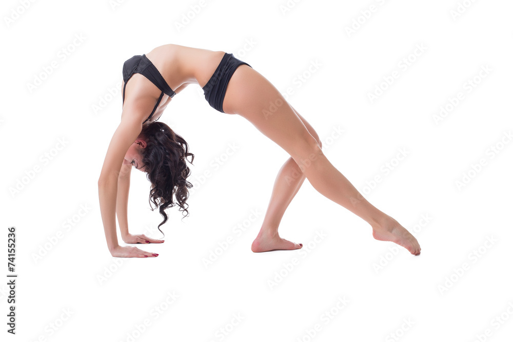 Flexible slim woman doing pilates exercise Flexible slim woman doing pilates exercise