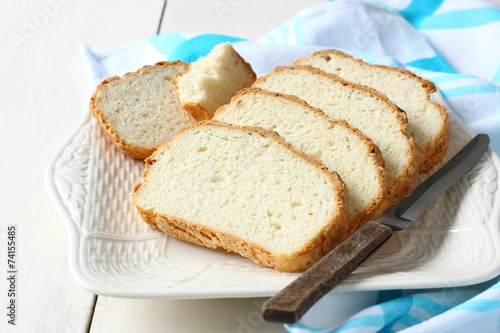 Fresh from the oven sliced gluten free bread on plate