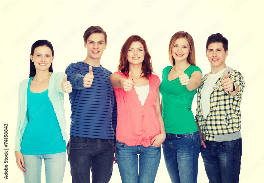 group of smiling students showing thumbs up group of smiling students showing thumbs up