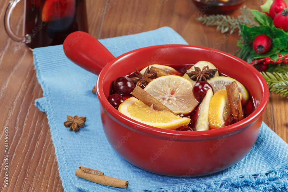 Mulled wine.Casserole with mulled wine, fruits and spices