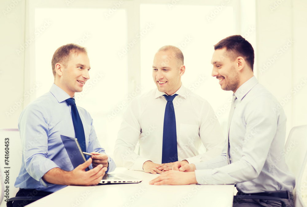 business team working with laptop in office business team working with laptop in office