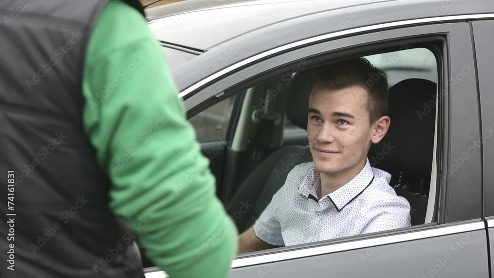 Young guy takes his car to the service station Young guy takes his car to the service station