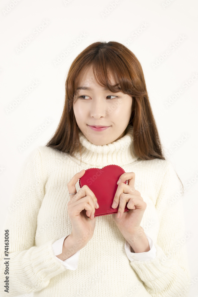 Smiling young asian woman with red heart shape Smiling young asian woman with red heart shape