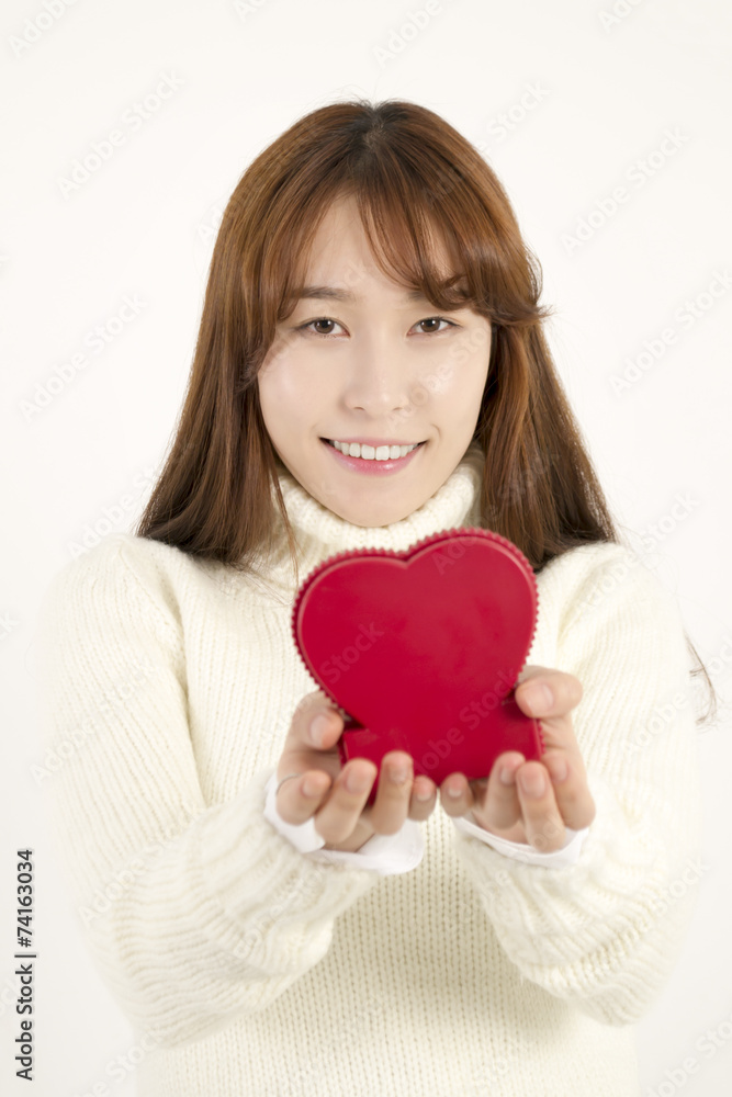 Smiling young asian woman with red heart shape Smiling young asian woman with red heart shape