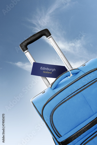Edinburgh, Scotland. Blue suitcase with label