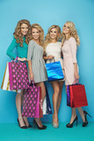 Four fabulous women with shopping bags