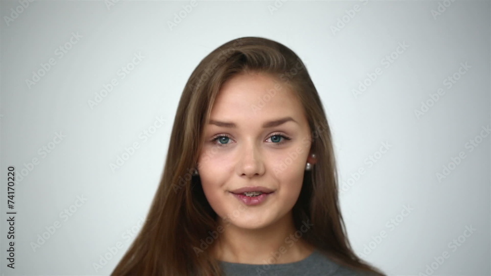 Young girl with braces on teeth throws back her head. Young girl with braces on teeth throws back her head.