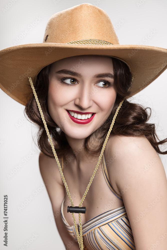 portrait of a brown-haired woman in cowboy hat