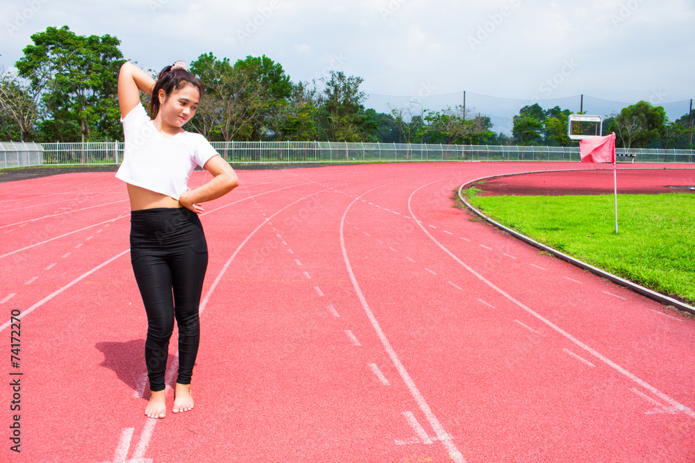 female athlete warm up in stadium arena and race running track t