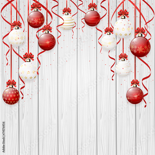 Red Christmas balls on wooden background