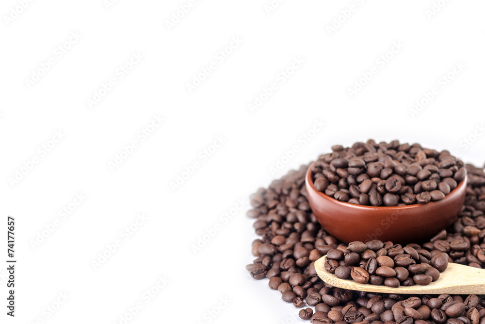 wooden spoon on a background full bowl of coffee beans wooden spoon on a background full bowl of coffee beans