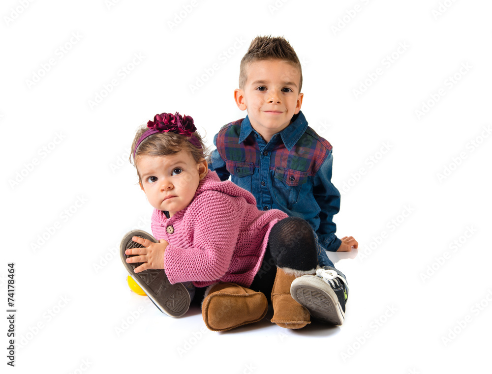 Brothers playing over white background Brothers playing over white background