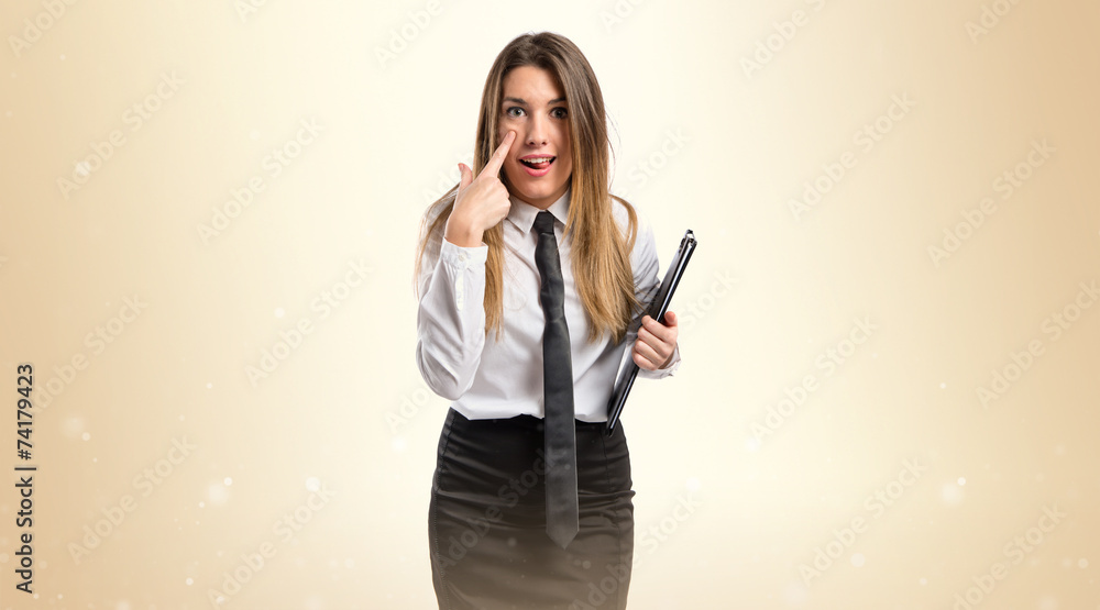 Pretty girl doing a joke over white background Pretty girl doing a joke over white background