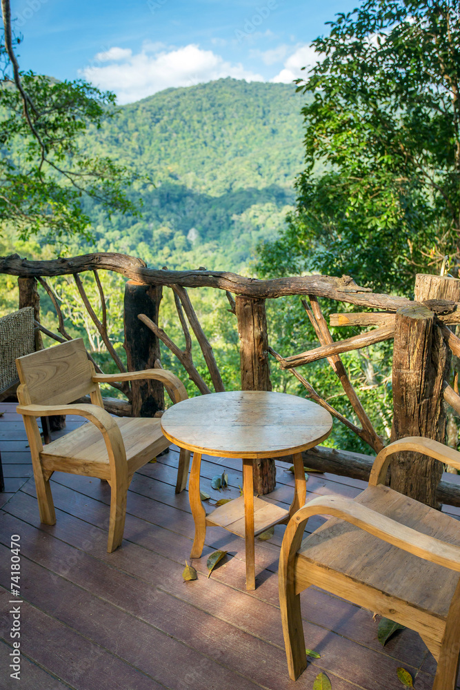 Wooden table and chairs in the cafe with a wonderful mountain vi