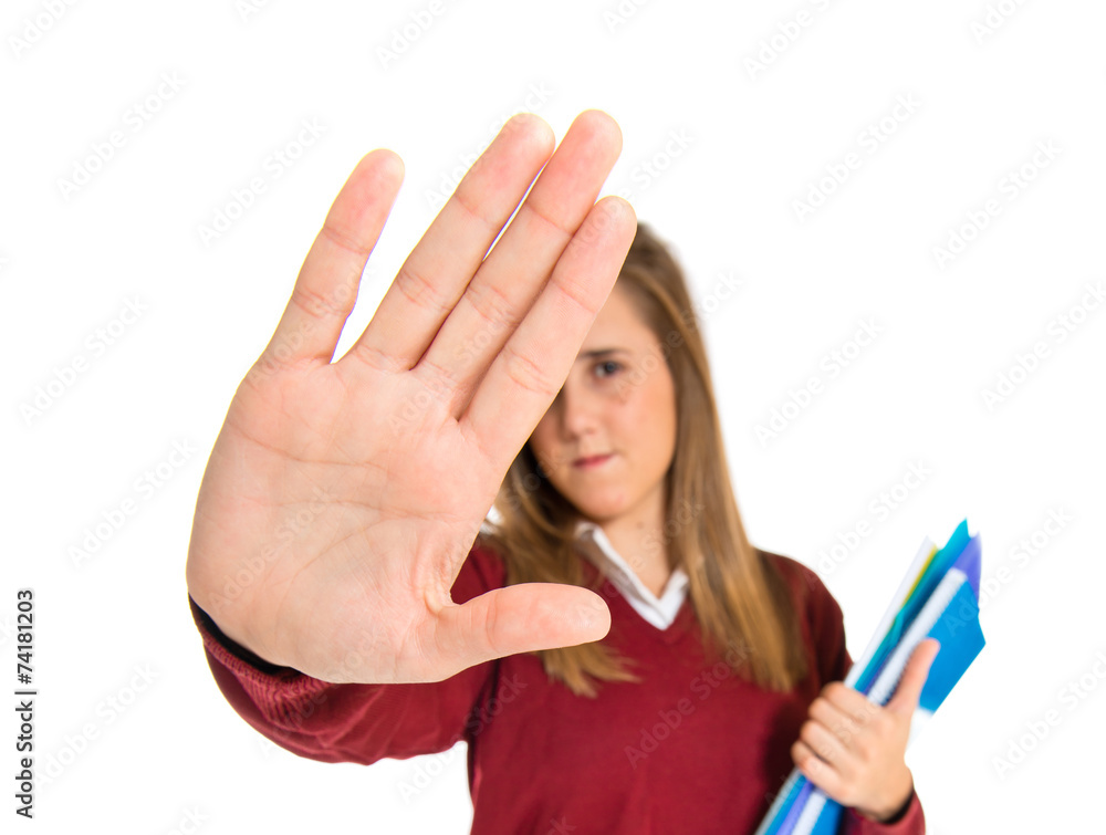Student making stop sign over white background Stock Photo | Adobe Stock