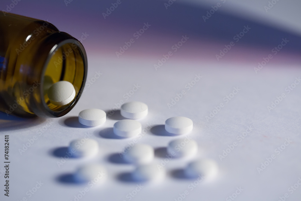 pills. White medical pills on blue background pills. White medical pills on blue background