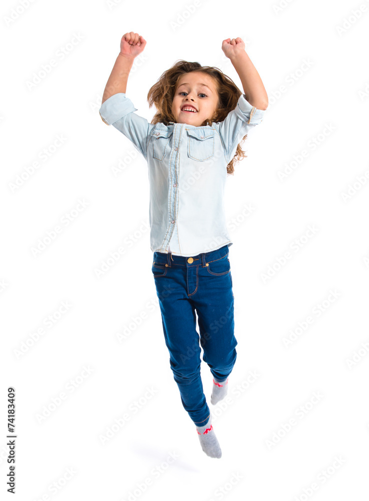 Blonde little girl jumping over white background Blonde little girl jumping over white background
