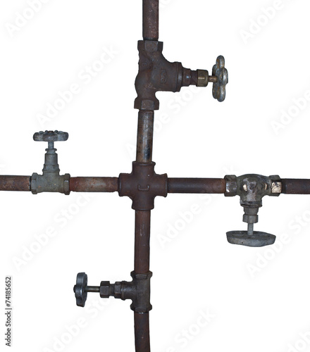 fragment of the old water conduit consisting of pipes, fittings