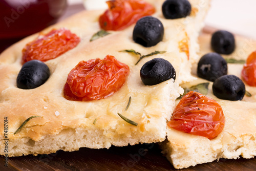 Focaccia with black olives, tomatoes and basil