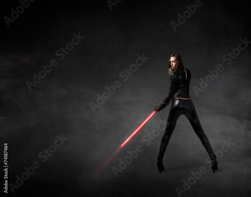 girl in a futuristic military version with laser sword