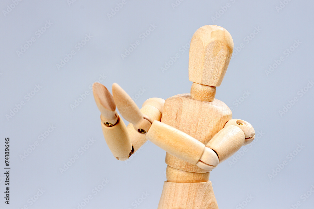 Wooden mannequin applauds