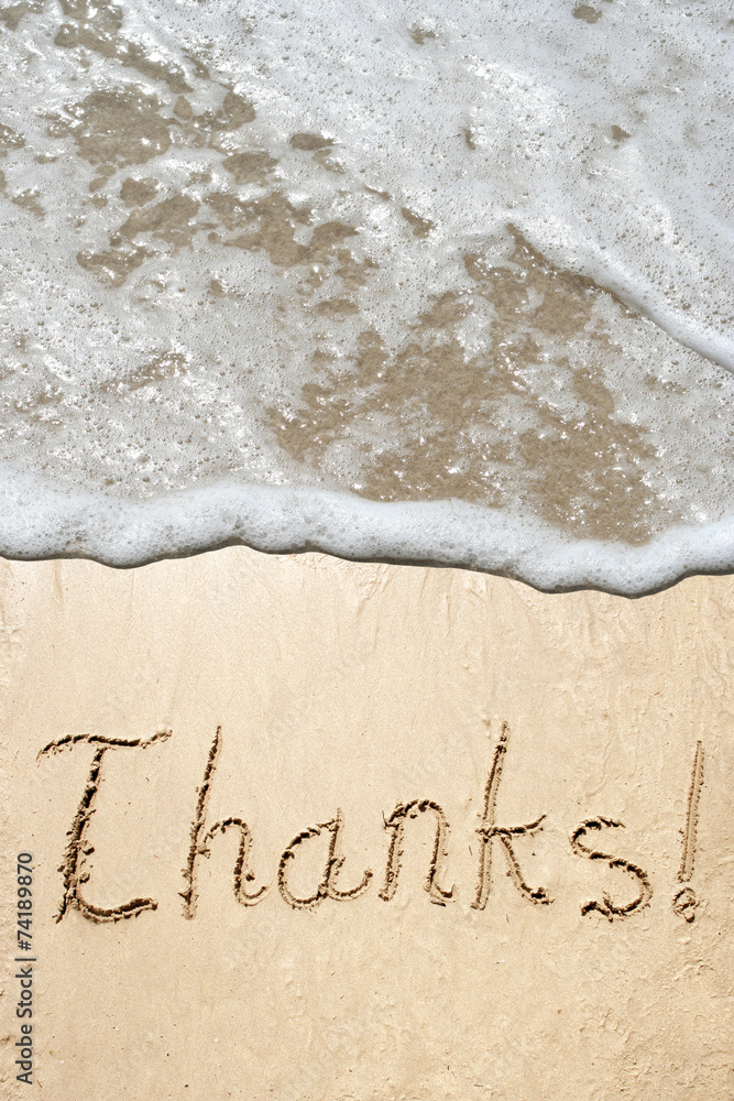 Conceptual thank you text in sand and water Conceptual thank you text in sand and water