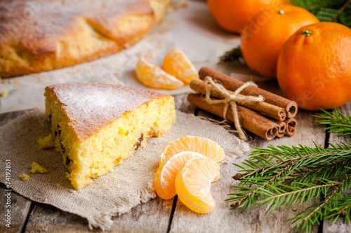 Christmas piece of biscuit cake with mandarin and cinnamon