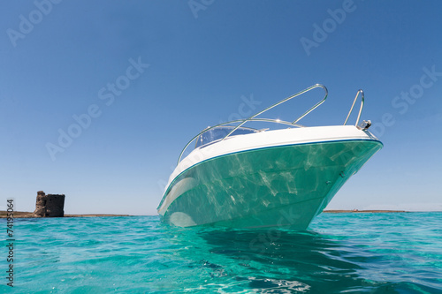 Luxury yatch in turquoise beach of Stintino, Sardinia, Italy