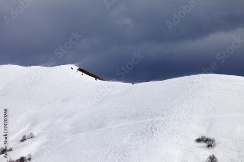 Off-piste slope and overcast gray sky in bad weather day © BSANI