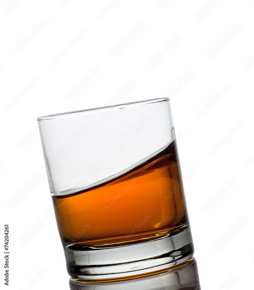 Isolated shots of whiskey with splash on white Isolated shots of whiskey with splash on white