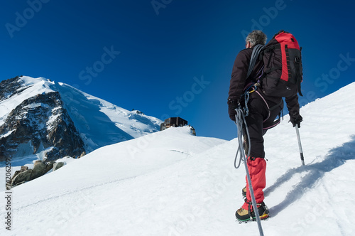 Mountaineer walking on the glacier during the climb of Mont Blan