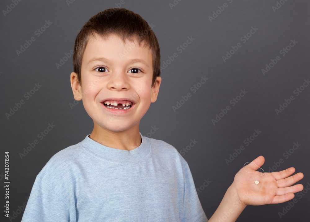 boy with lost tooth on thread boy with lost tooth on thread