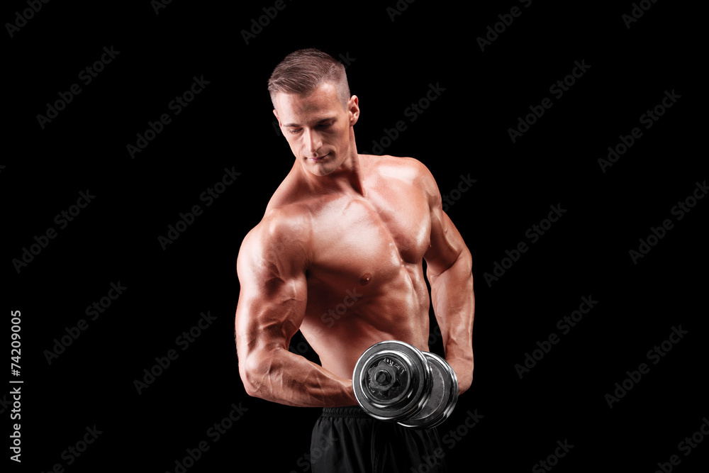 Male bodybuilder lifting a metal weight