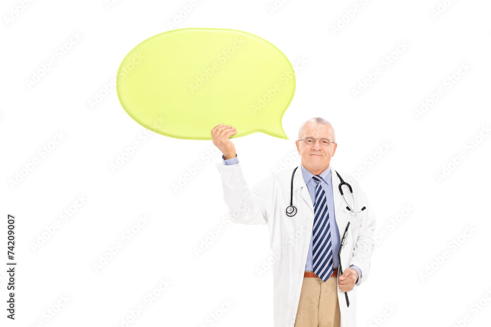 Mature doctor holding a big yellow speech bubble Mature doctor holding a big yellow speech bubble