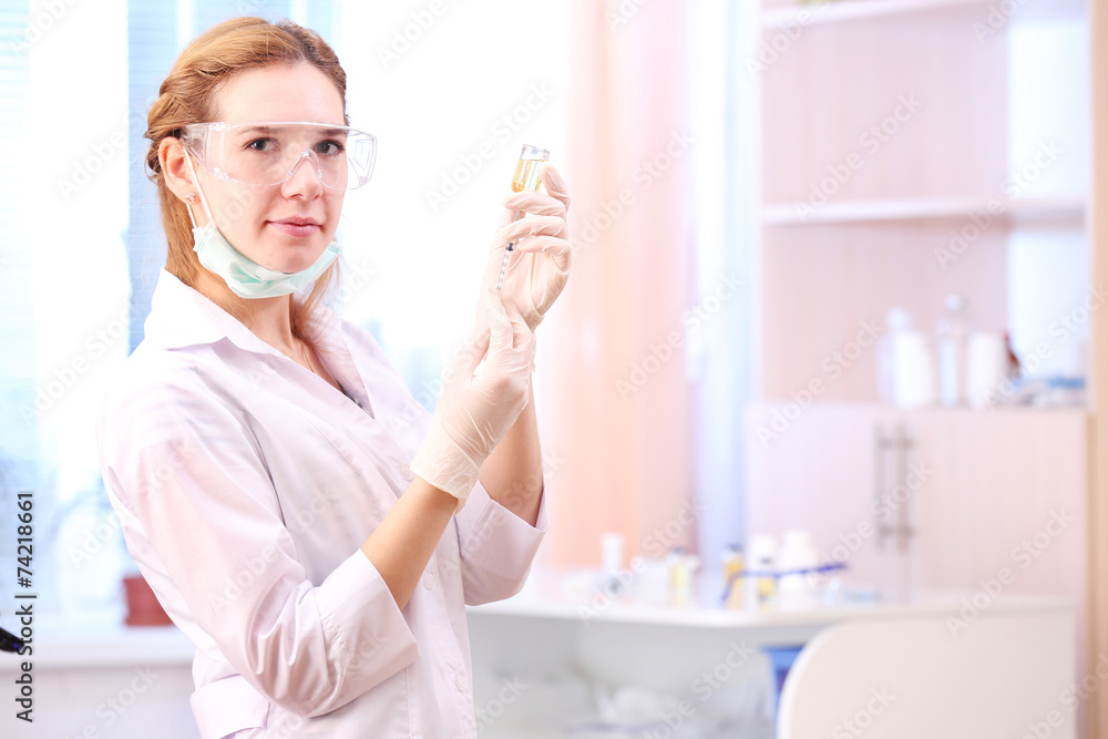 Doctor with medical syringe in hands, getting ready for Doctor with medical syringe in hands, getting ready for