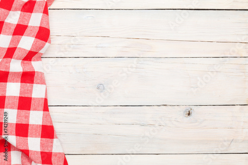 Red towel over wooden kitchen table